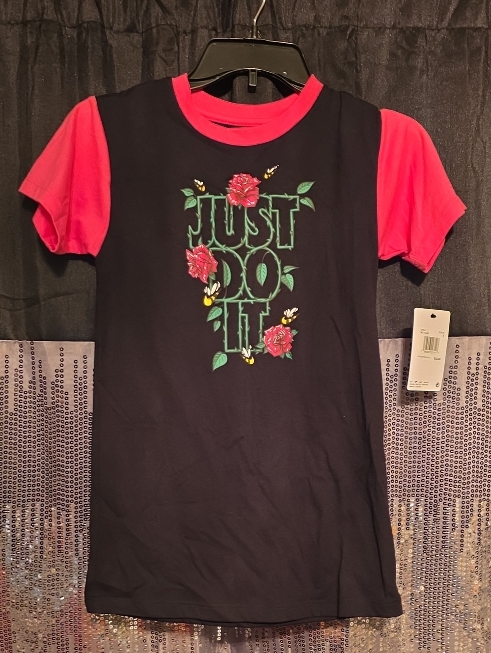 Nike Kids "Just Do It" Black Tee with Pink Sleeves and Floral Graphic